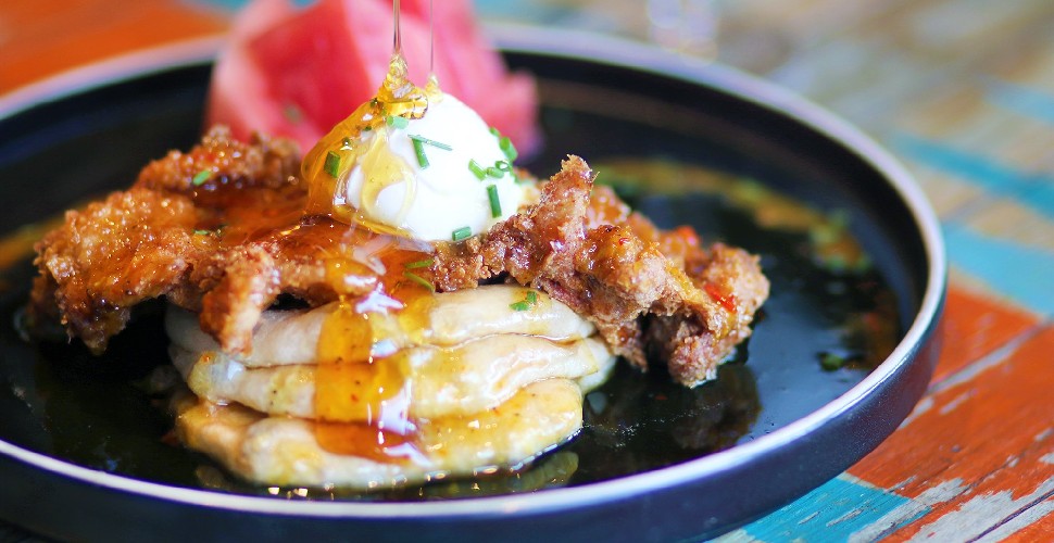 Turtle Bay's Honey Bunny Yardbird, roti stacked with buttermilk crispy chicken, cream cheese, rich maple syrup, hot sauce and juicy watermelon